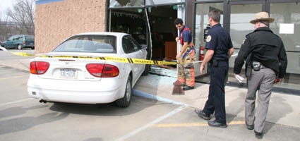 Car drives through front doors of Wilber Bank
