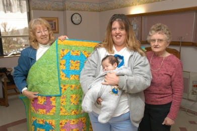 Quilt Guild makes donation to CMH baby