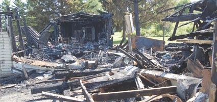 Sherburne man hospitalized after fire destroys home