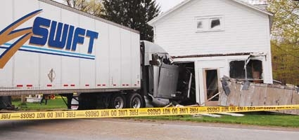 No one injured in car, tractor trailer crash