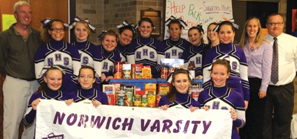 Cheerleaders collect food for the hungry