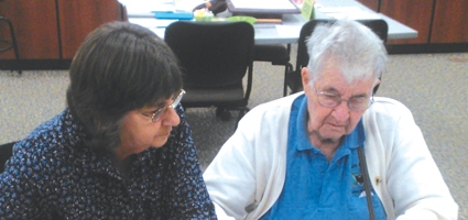 Volunteers use Scrabble to support literacy 