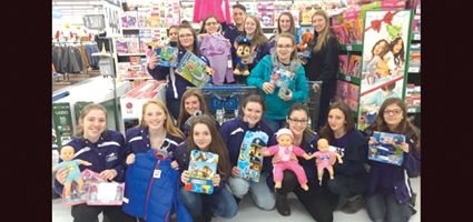 Cheerleaders ‘adopt’ children; help them shop for holiday gifts