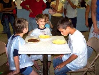 Grange hosts pie-eating contest at county fair