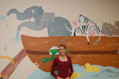 Local artist paints nursery school mural