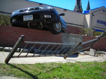 Car goes over the wall at Eckerd's