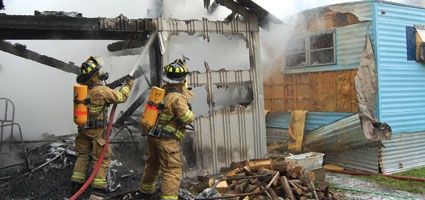 Crews save home from spreading garage fire