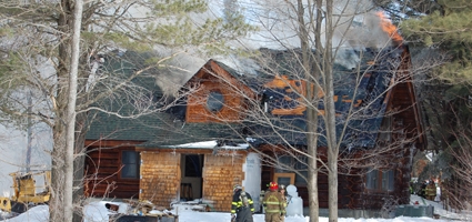 Firefighters battle cabin blaze 