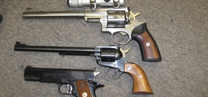 Police raid parolee’s home and uncover illegal handguns