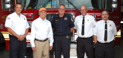 Hanna discusses financial burdens and volunteerism with fire officials
