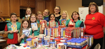 Girl Scouts work on birthday party project