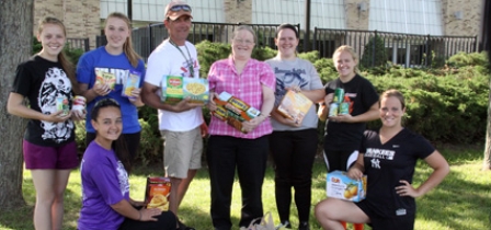 FURY softball team donates to Roots and Wings