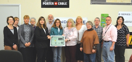 Norwich Merchant's Association presents contest winner with prize at Curtis Lumber