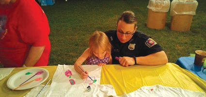 Norwich officers paint with children at Relay For Life