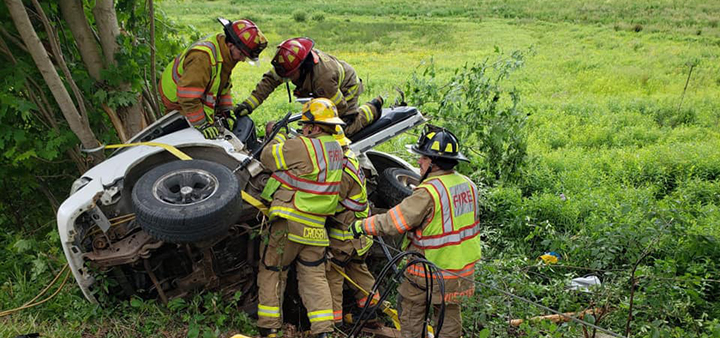 Firefighters Save Two Trapped In Crushed Car