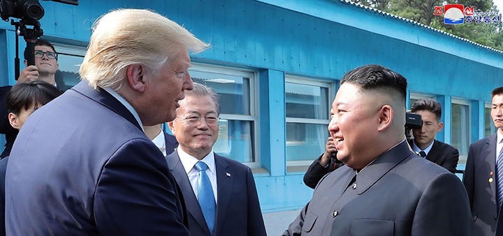 Trump smiles with North Korea, threatens Iran