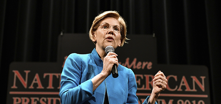 Warren apologizes for heritage claim, woos Native Americans